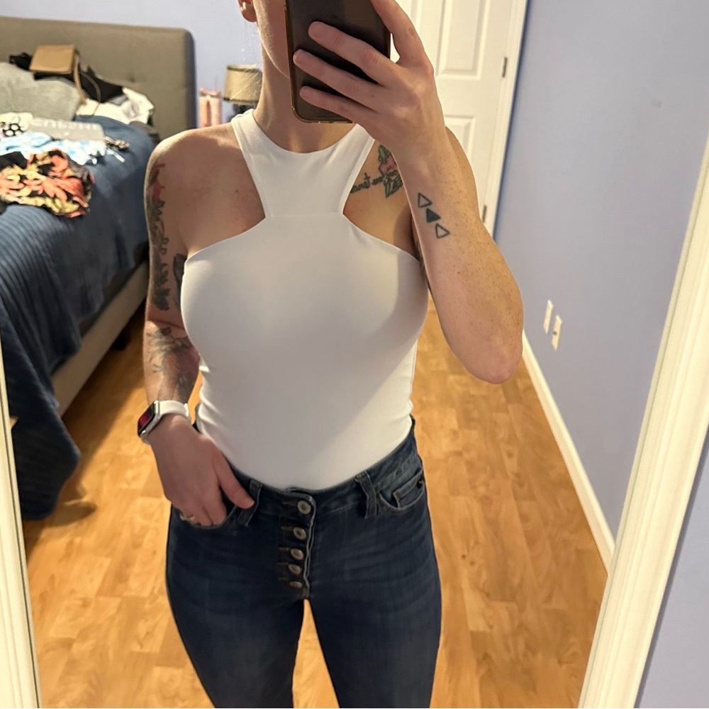 NWT. Size small double lined bodysuit
